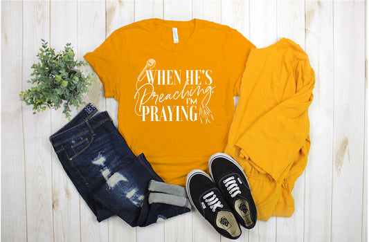 "He's Preaching, I'm Praying" White Letter Tee